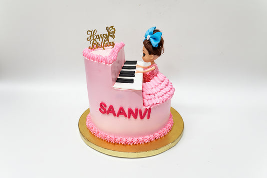 Pink cake with piano design with Doll made by Kousy's cake studio