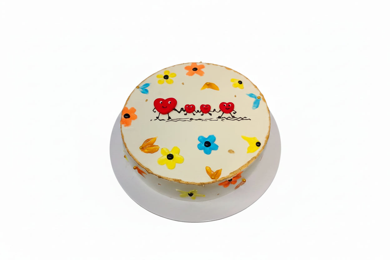 Decorative cake with cartoon designs on a black surface