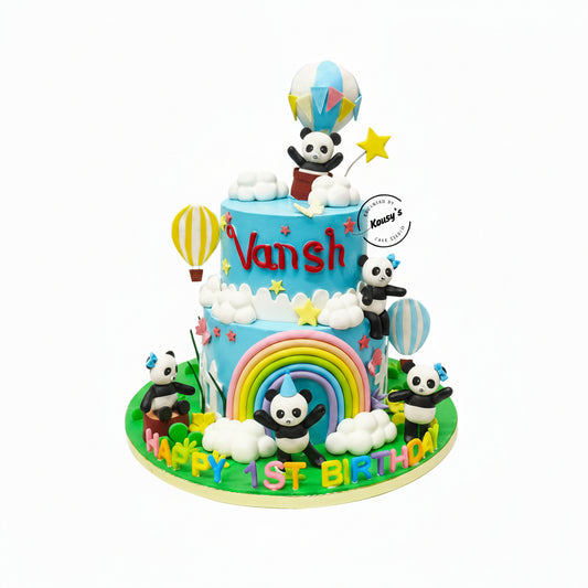 Colorful birthday cake with panda decorations and 'Vansh' written on it.