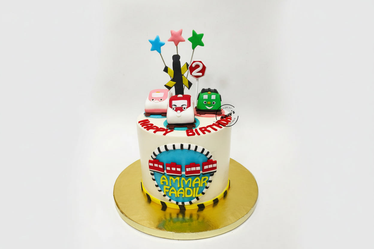 Birthday cake with toy trains and colorful candles on a white background