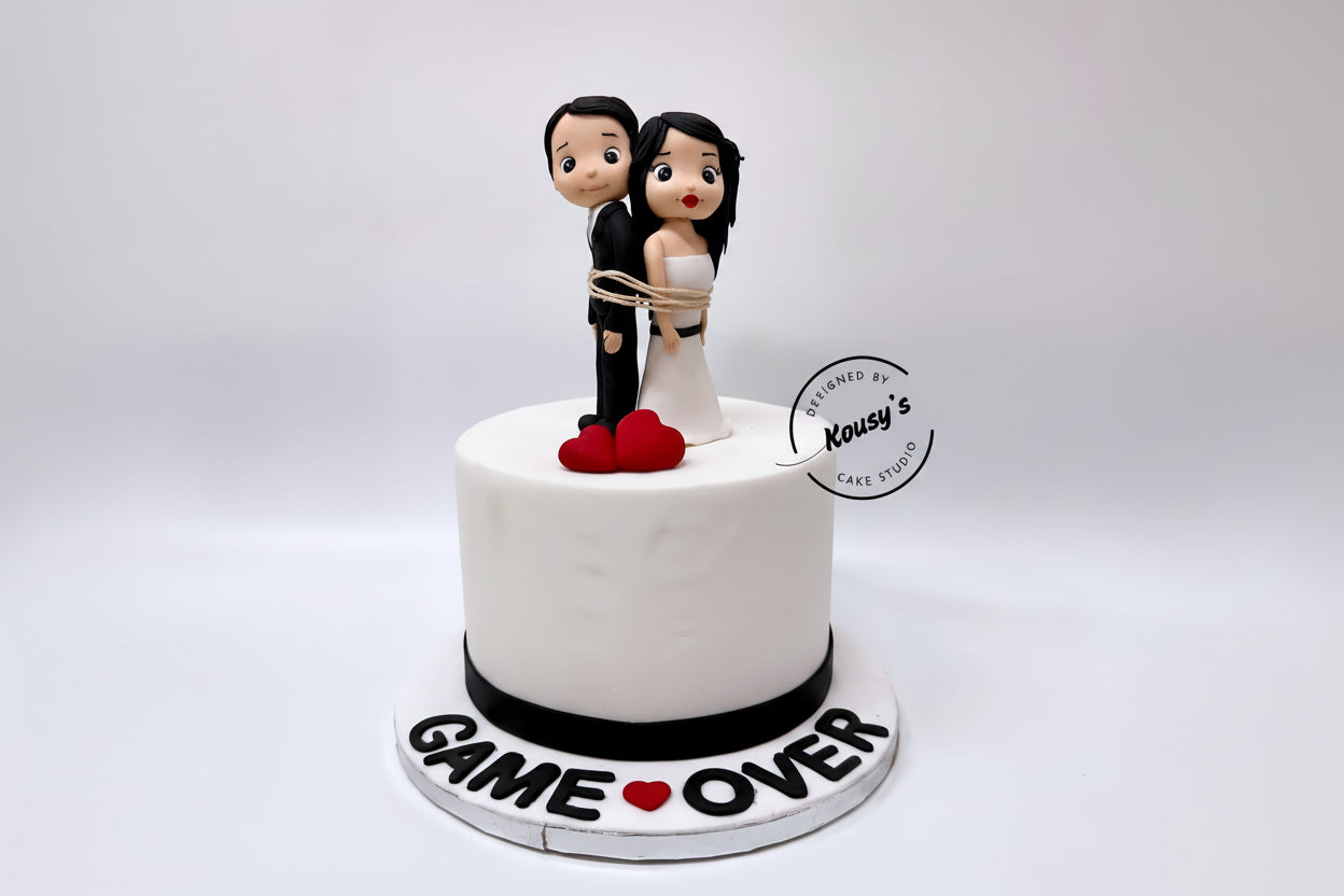 White Wedding cake with cartoon figurines